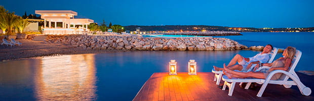 Couple on decking at night